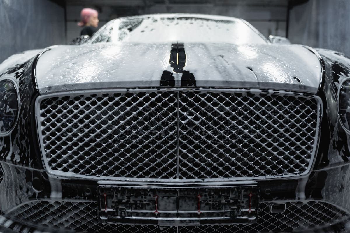 Professional detailer performing auto detailing on a real job