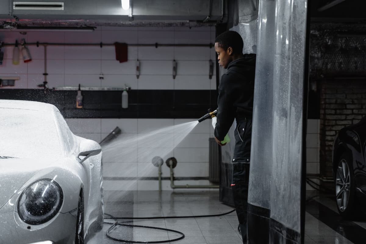 Professional detailer performing auto detailing on a real job