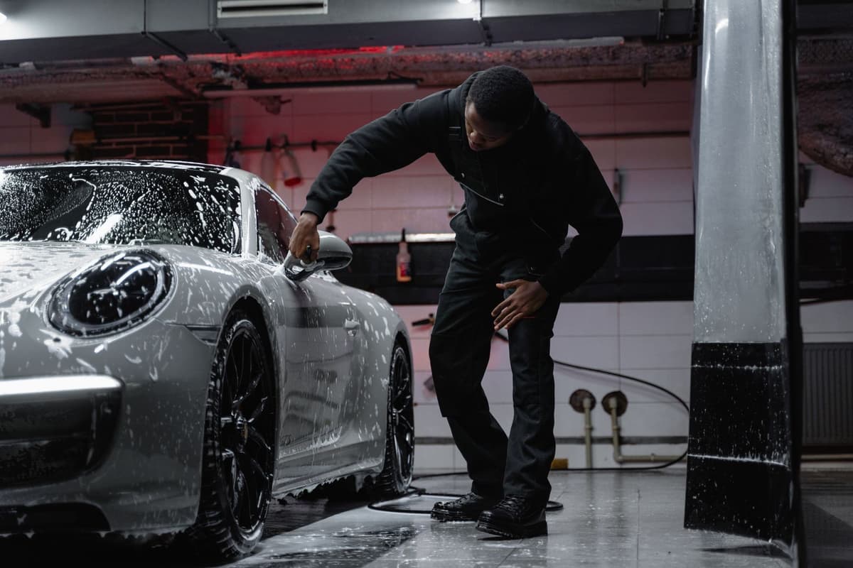 Professional detailer performing auto detailing on a real job
