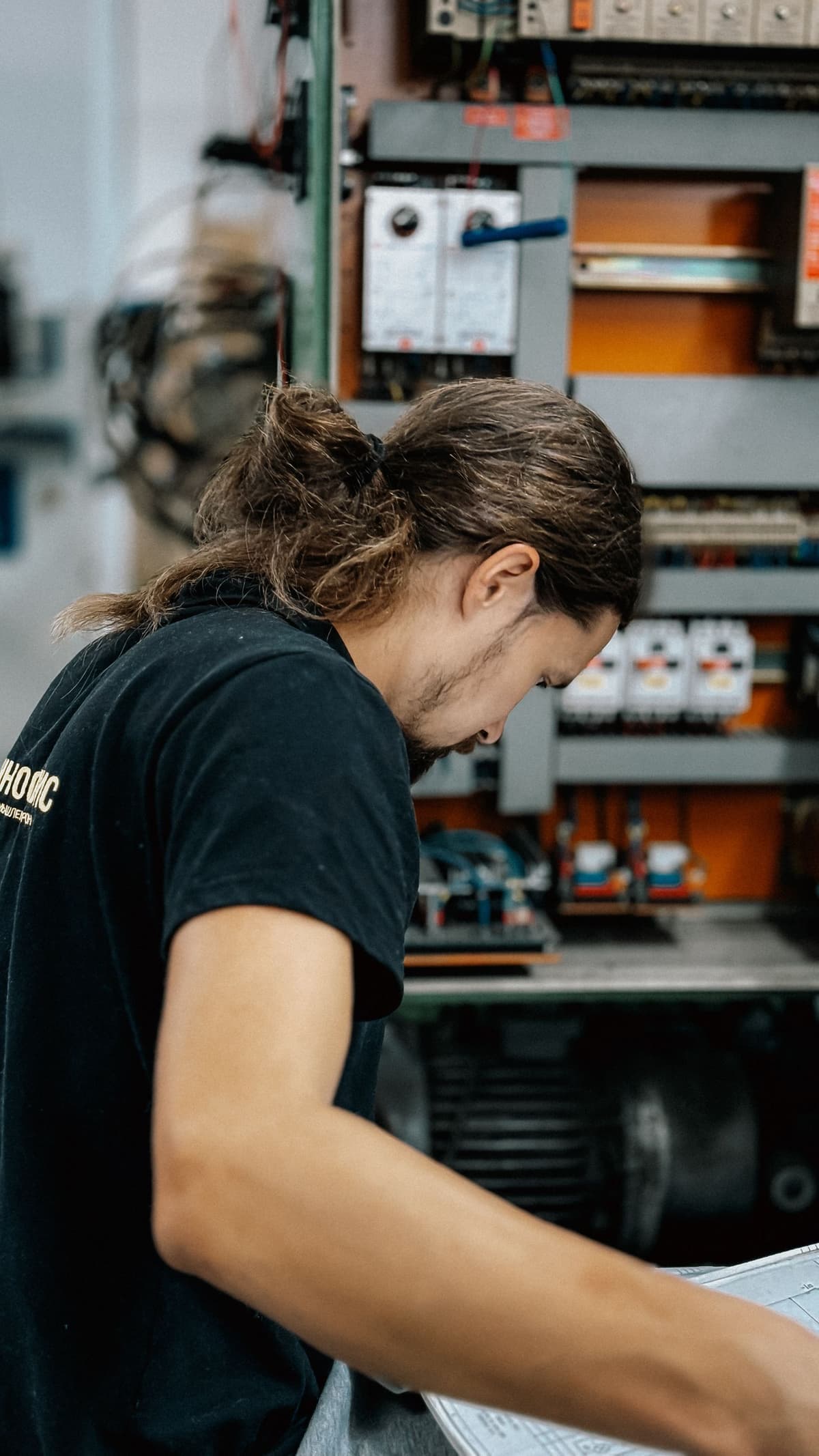 Professional electrician performing electrical work on a real job