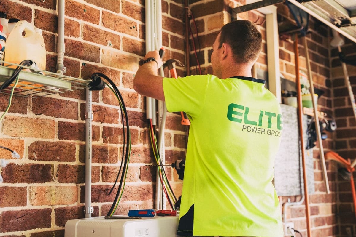 Professional electrician performing electrical work on a real job