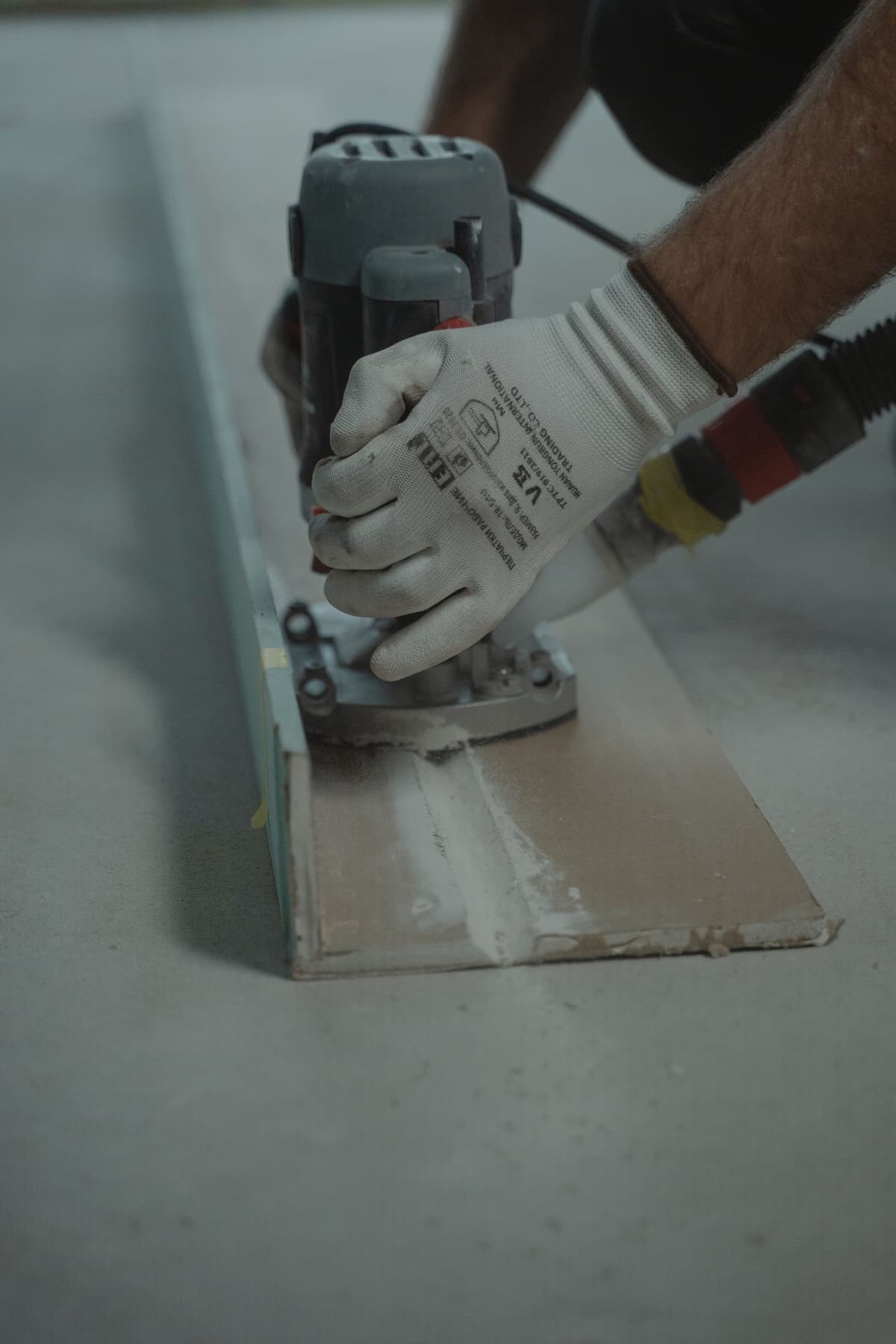 Professional handyman performing home repair work on a real job