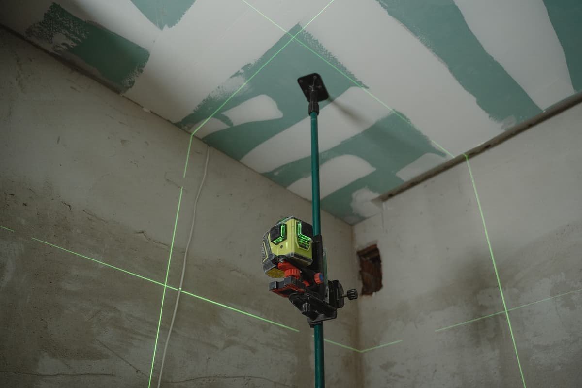 Professional handyman performing home repair work on a real job