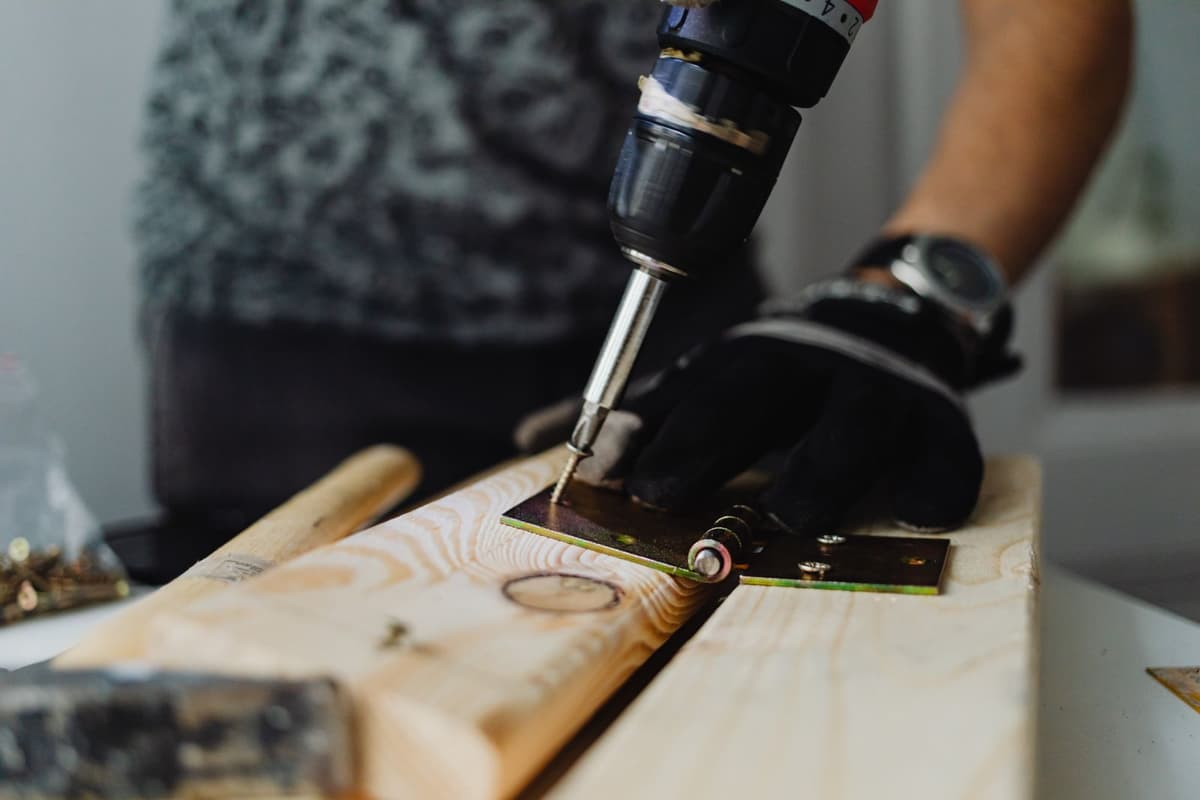 Professional handyman performing home repair work on a real job