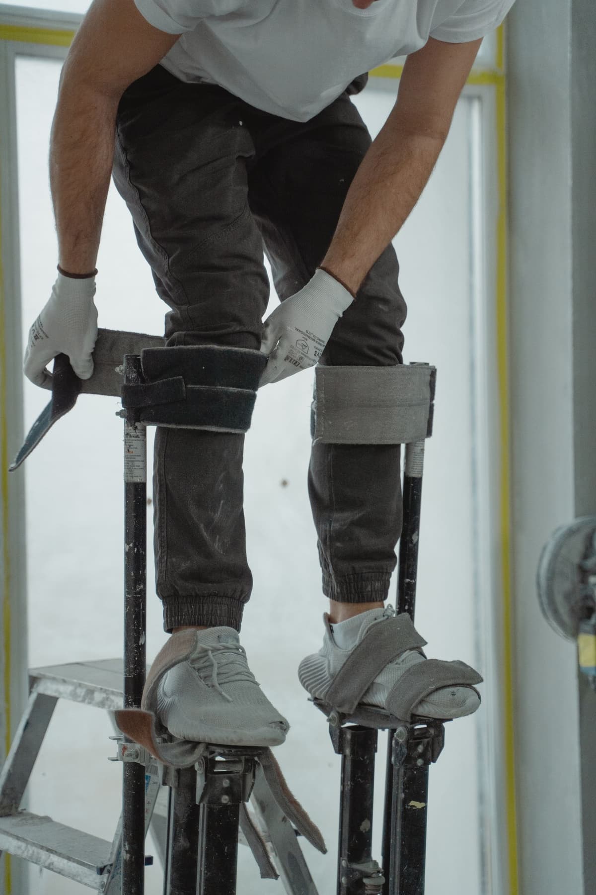 Professional handyman performing home repair work on a real job