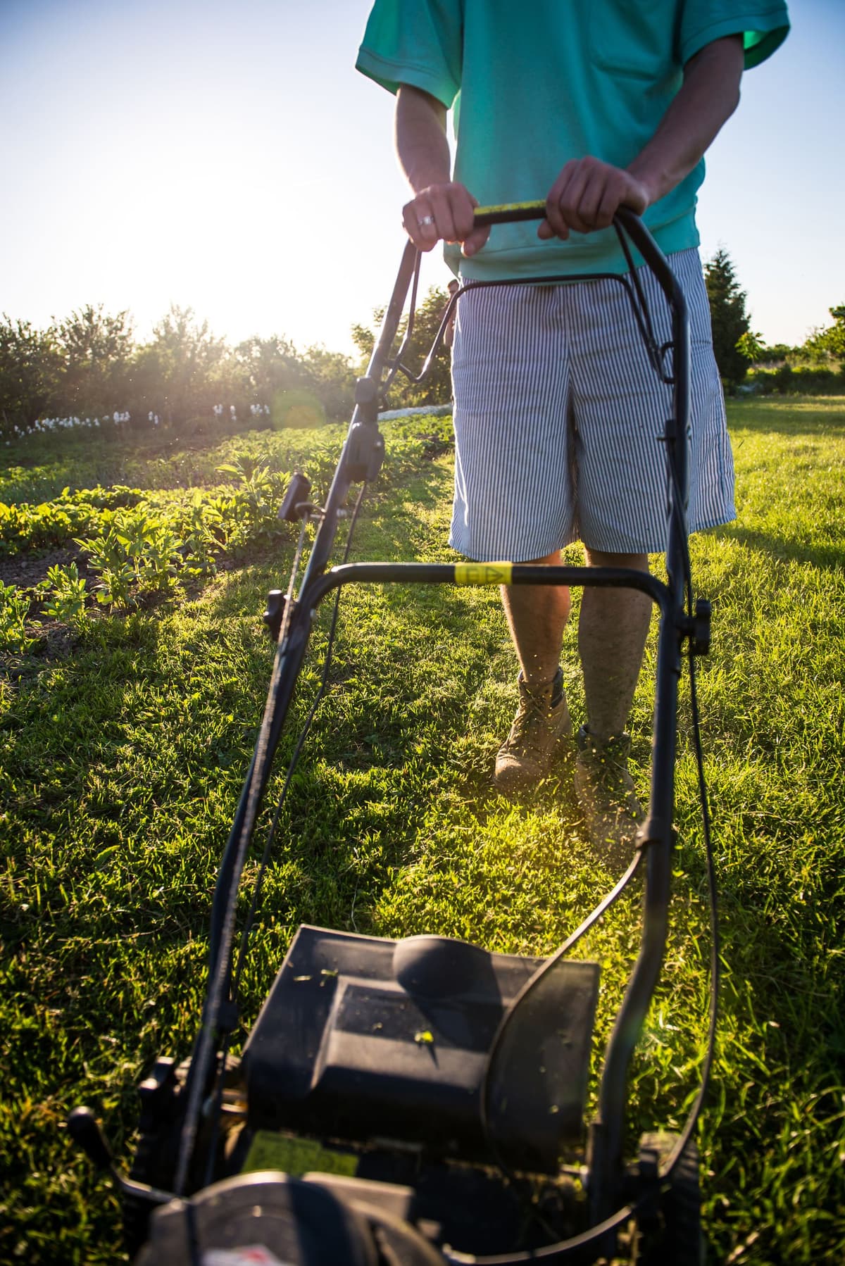 Professional landscaper performing landscaping work on a real job