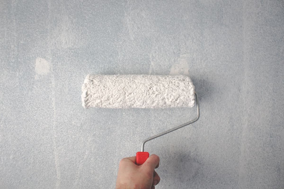Professional painter performing painting work on a real job
