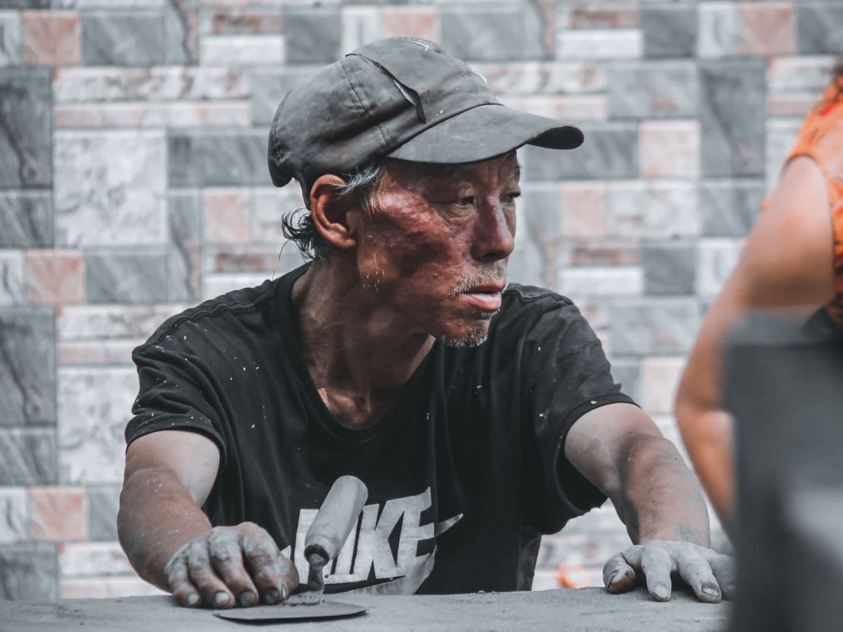 Bricklayer building a wall on a job site