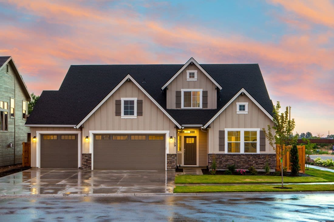Modern suburban home with attached garage and landscaped driveway