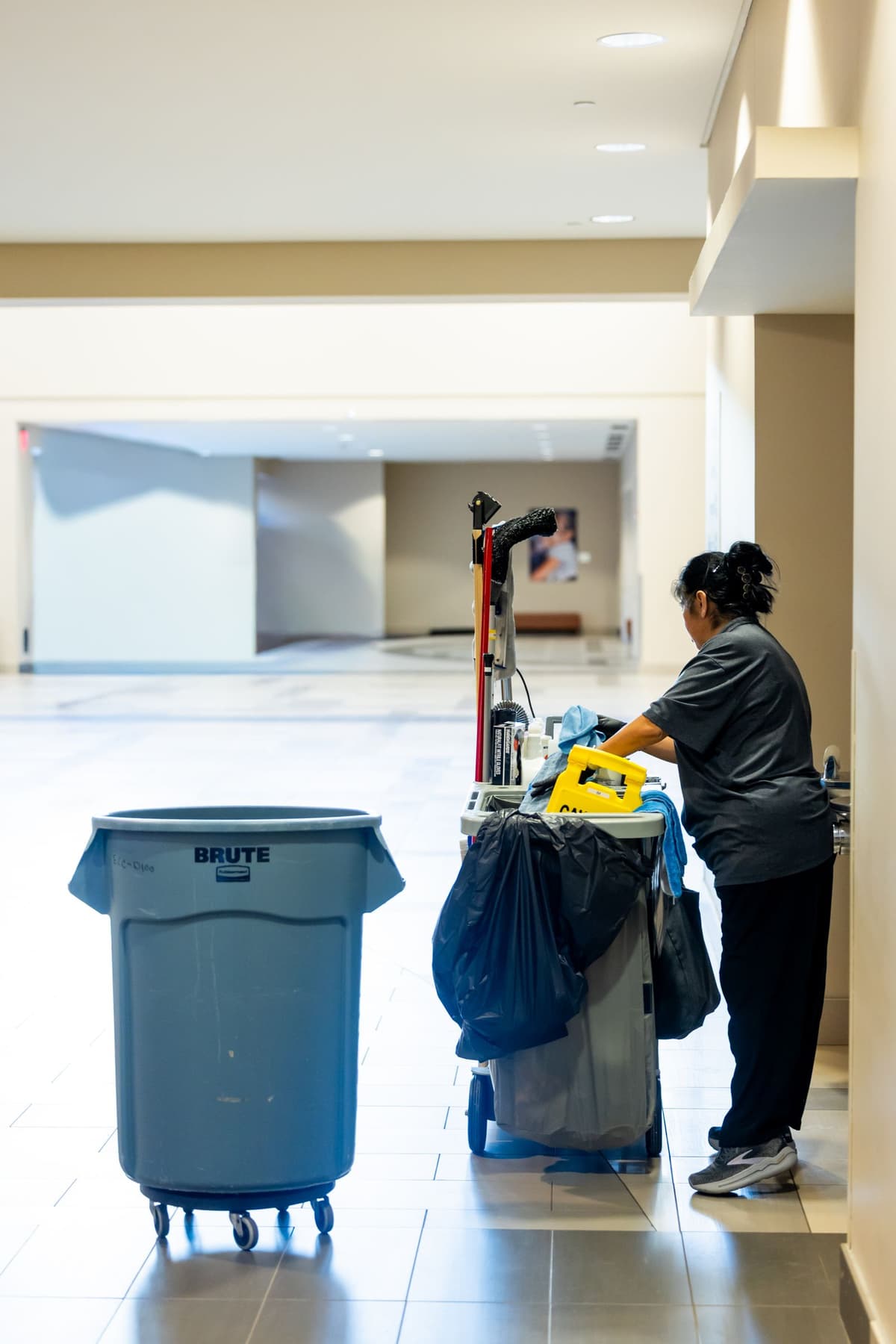 Professional cleaner performing cleaning services on a real job