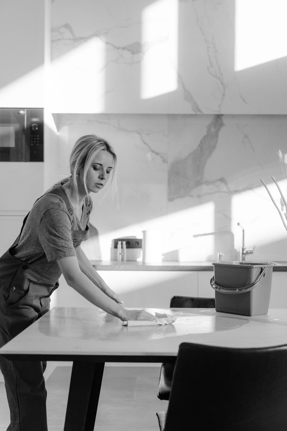 Professional cleaner performing cleaning services on a real job