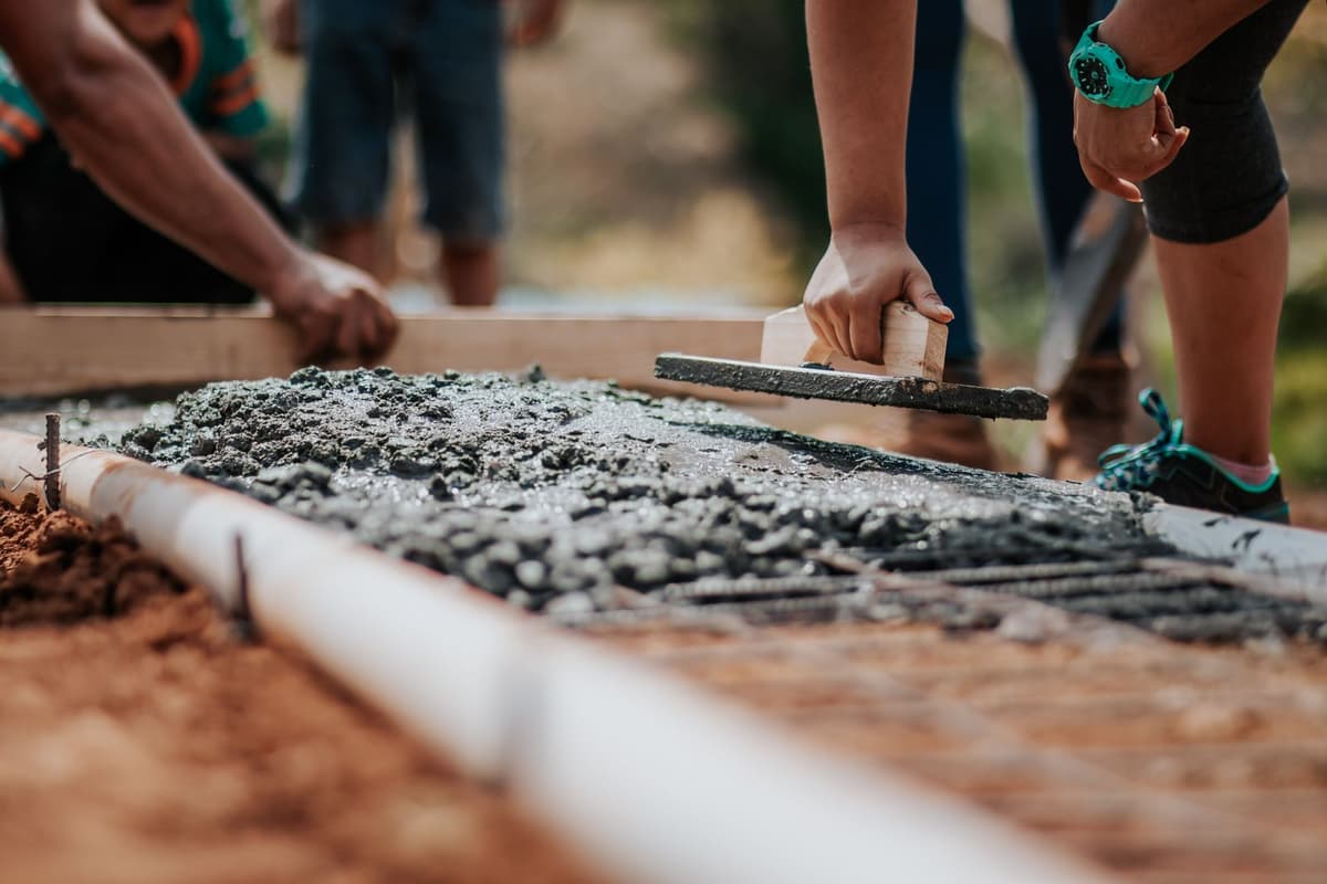 Professional concrete worker performing concrete and masonry work on a real job
