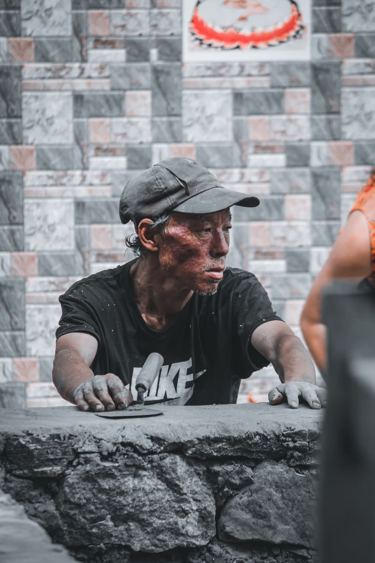 Professional concrete worker performing concrete and masonry work on a real job