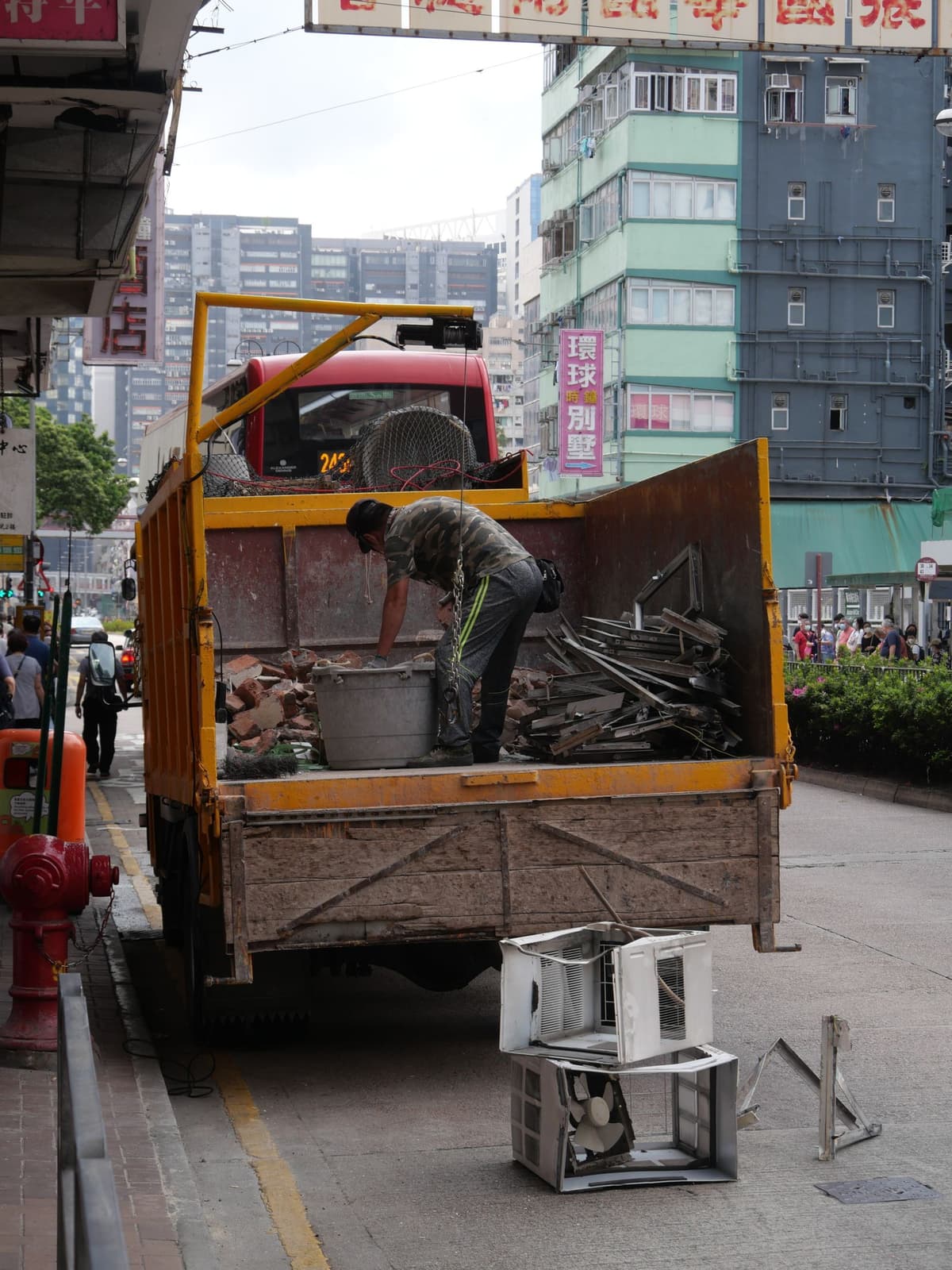 Professional junk removal crew performing junk hauling on a real job