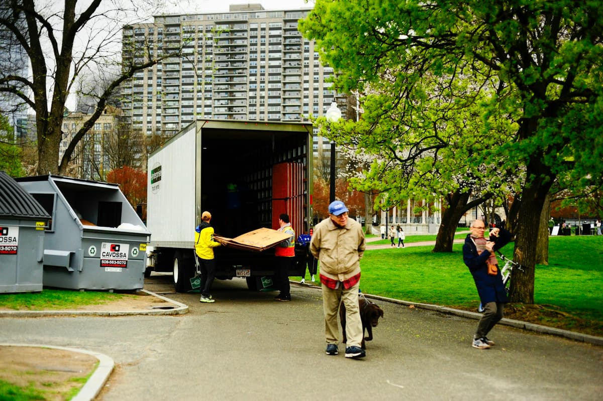 Professional junk removal crew performing junk hauling on a real job