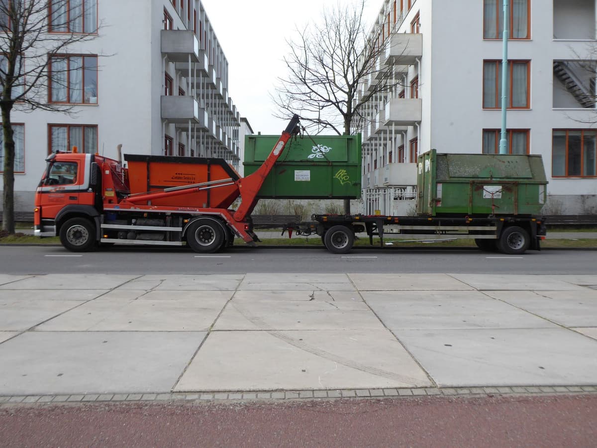 Professional junk removal crew performing junk hauling on a real job