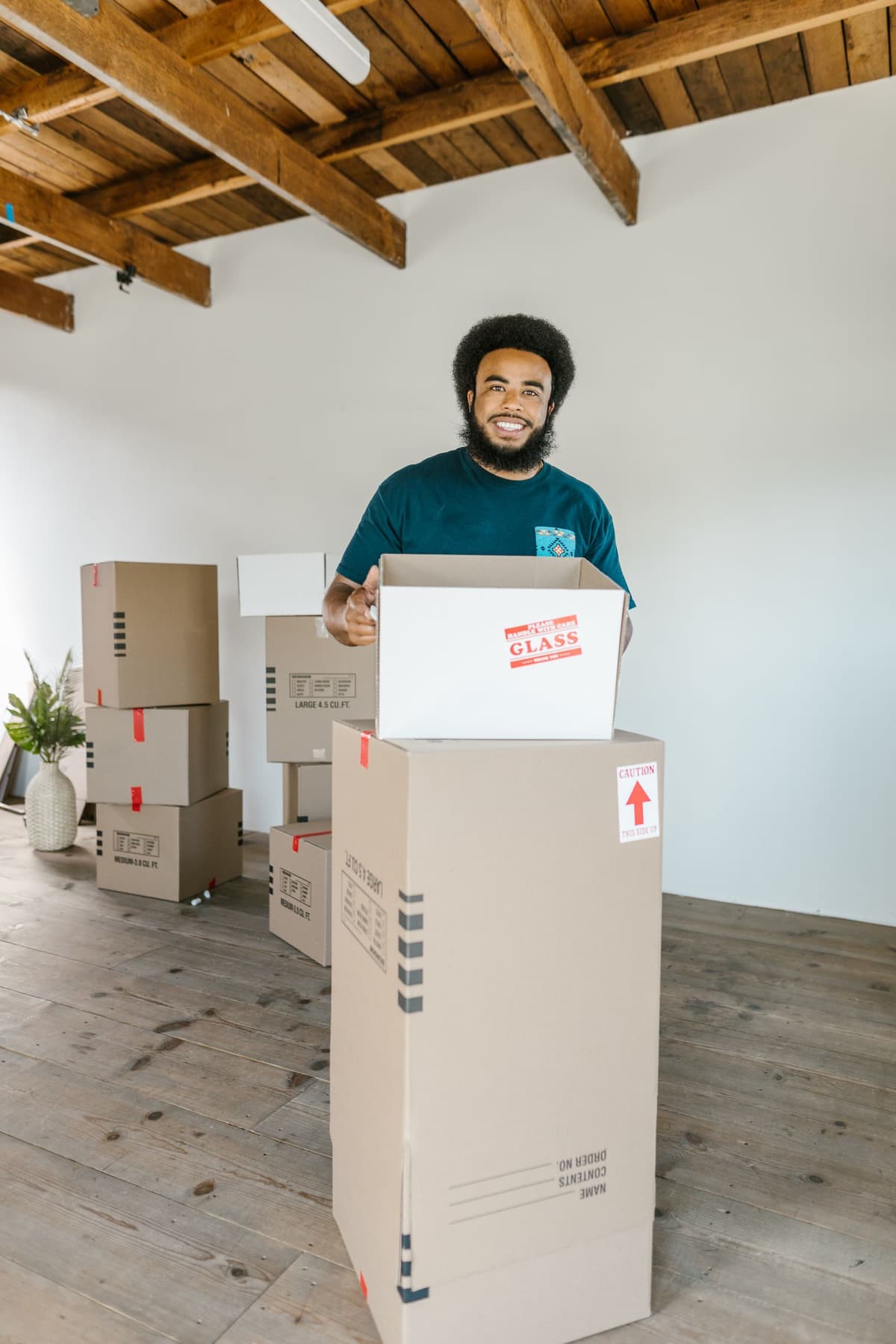 Professional mover performing moving services on a real job