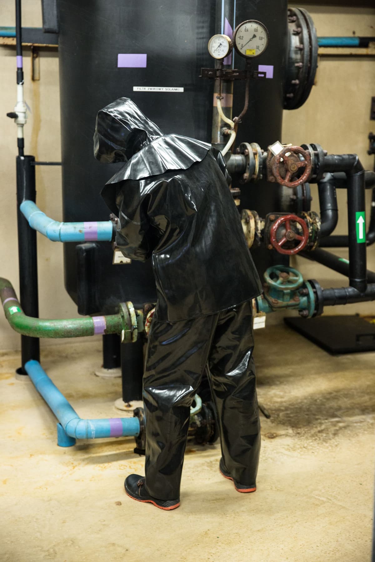 Professional pest control tech performing pest control service on a real job