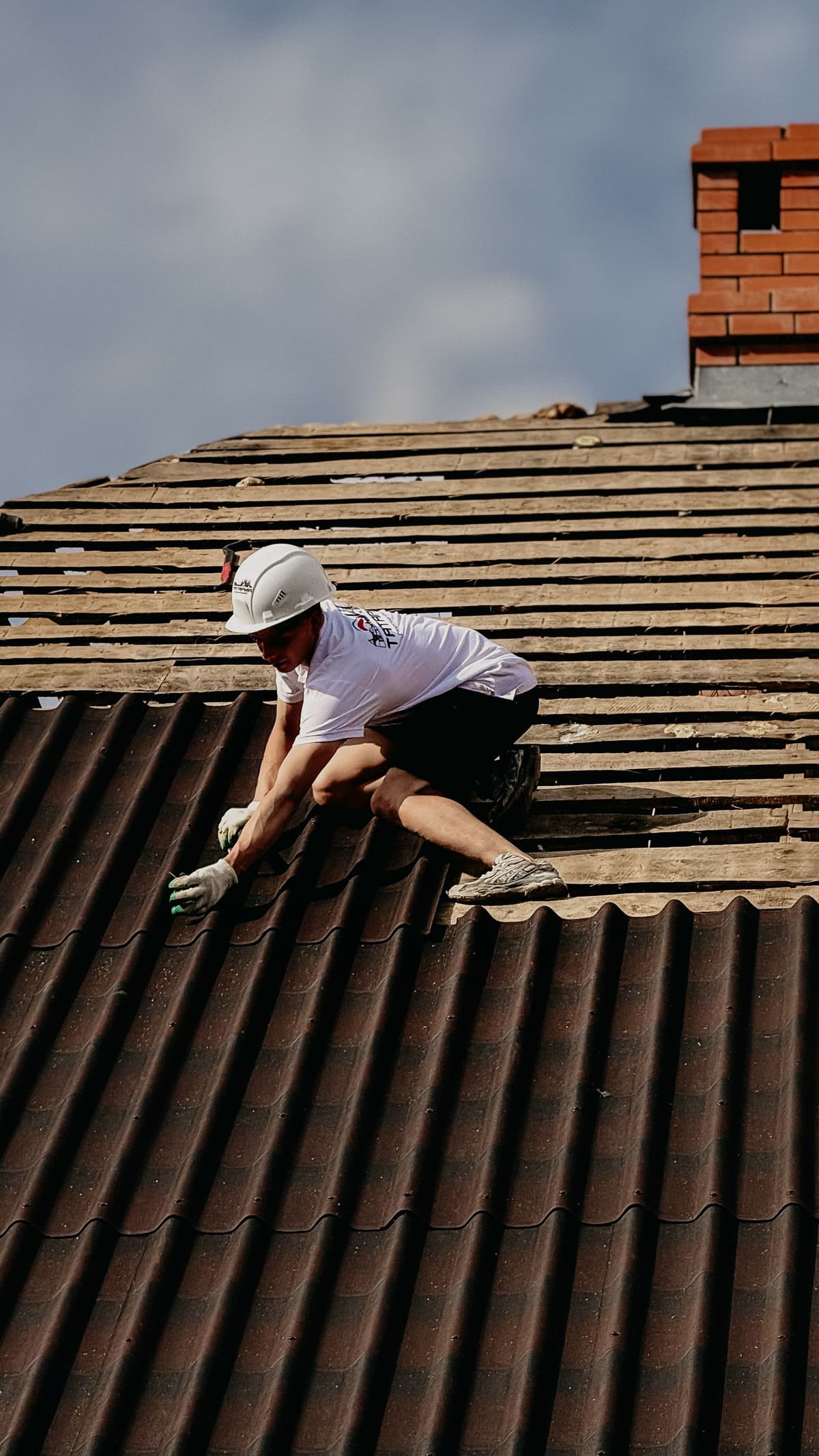 Professional roofer performing roofing work on a real job
