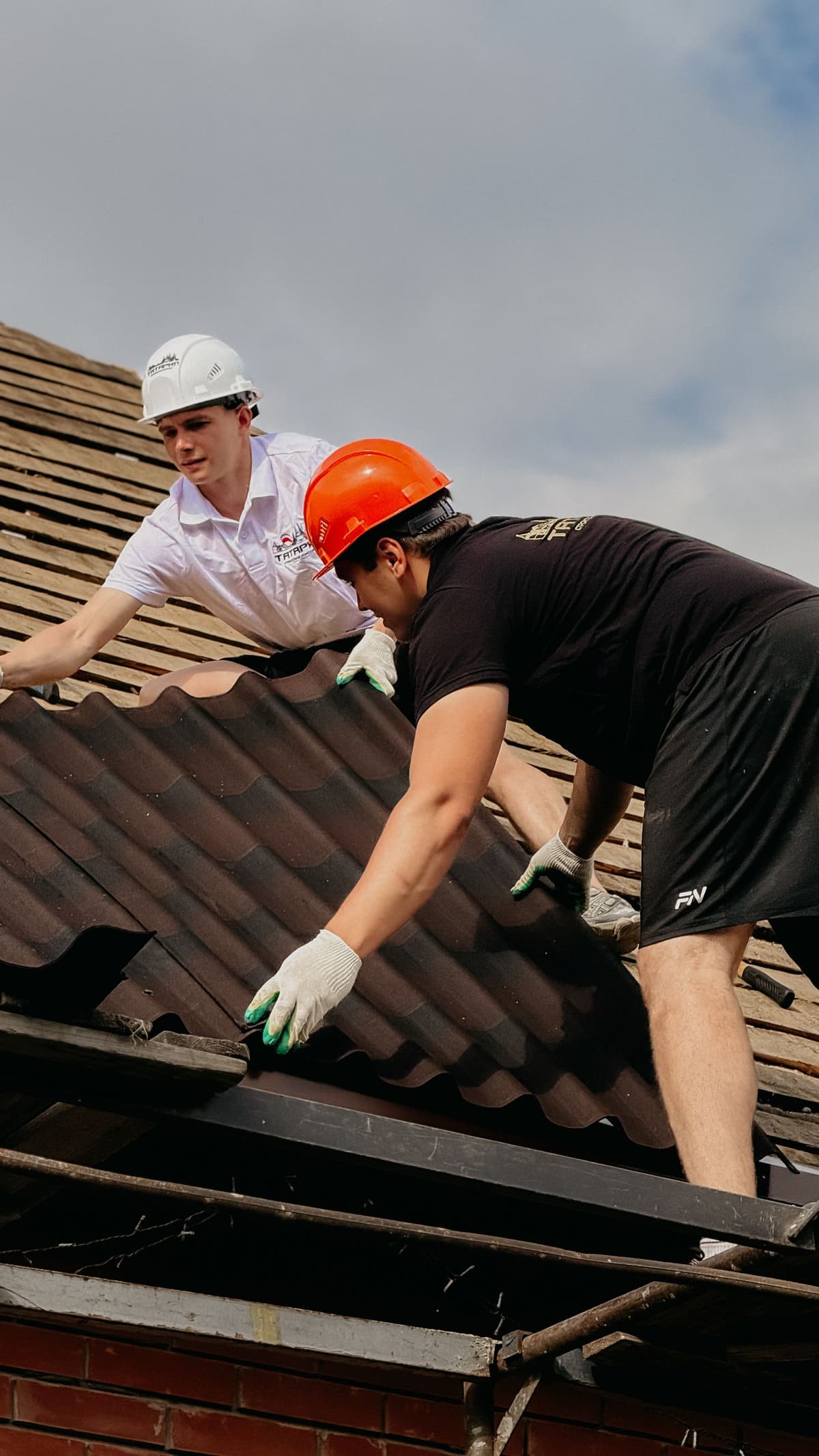 Professional roofer performing roofing work on a real job